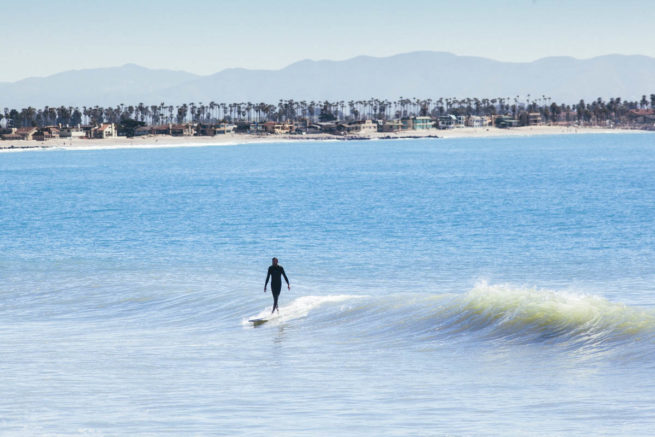 blue longboard longboarding surf afternoon noseriding