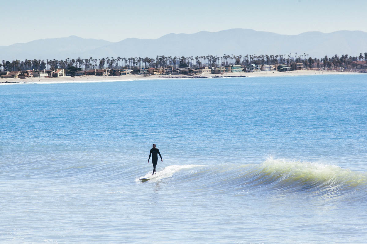 blue longboard longboarding surf afternoon noseriding