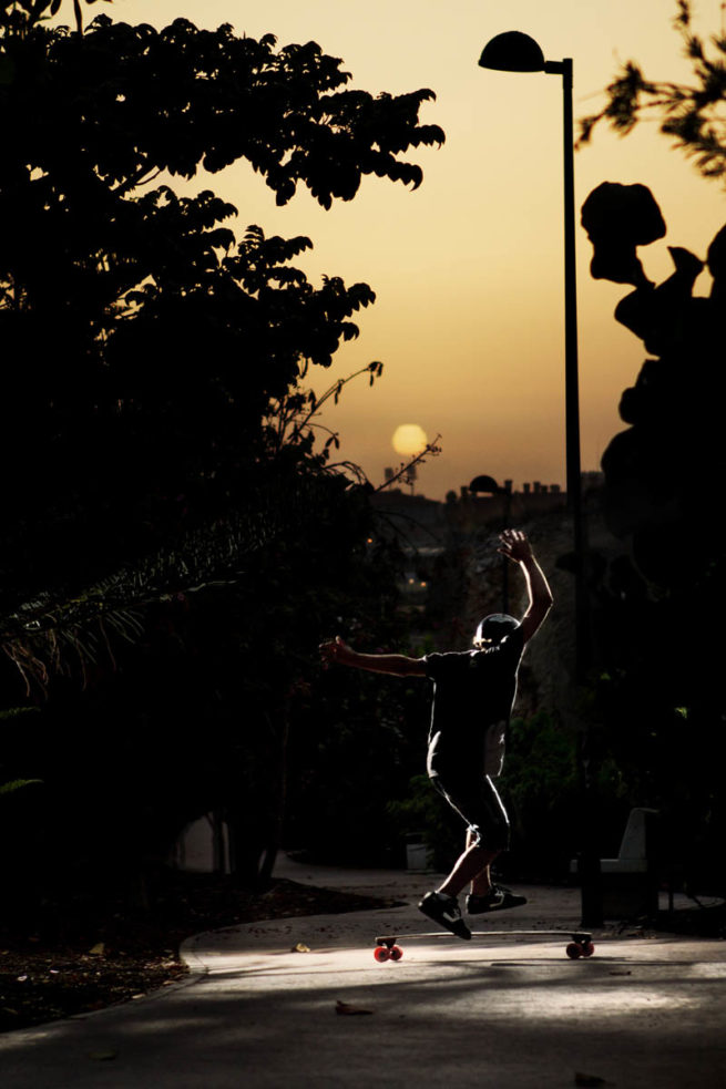 sunset light sun longboard skater